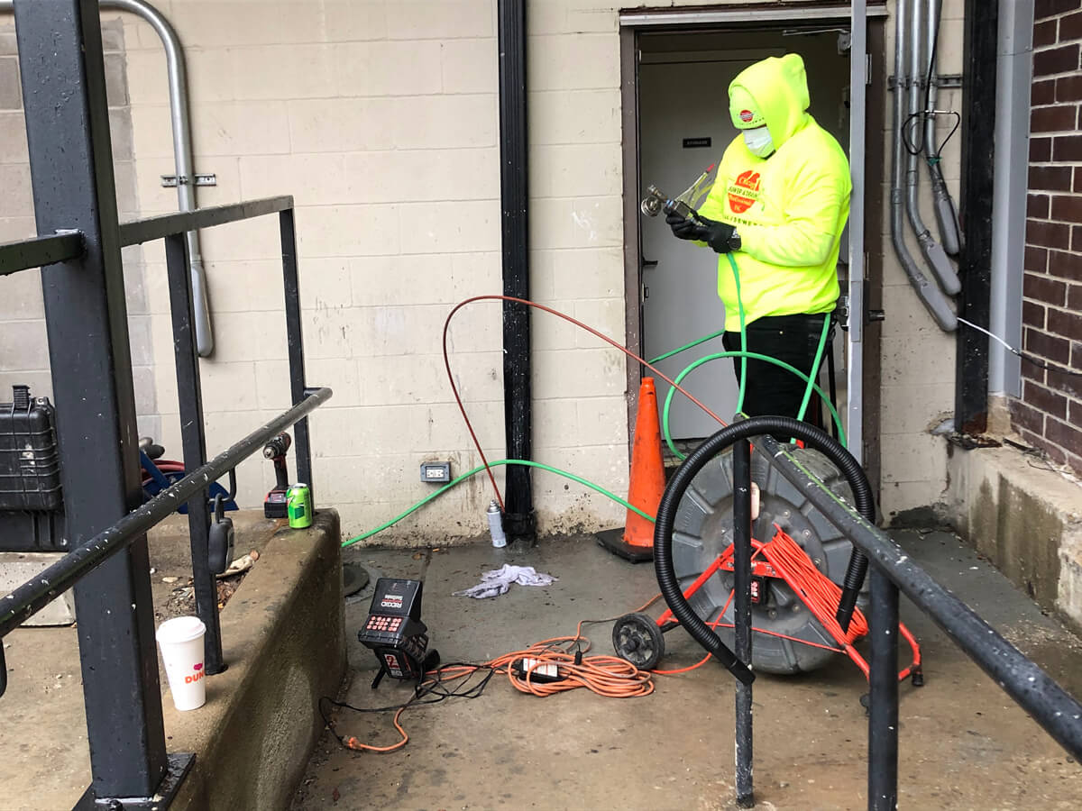 Worker Setting Up Hydro Jet Machine